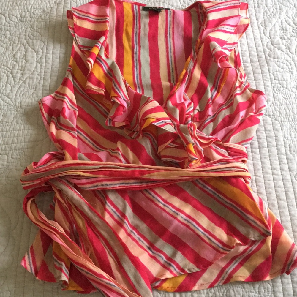 Sleeveless, ruffled summer top.